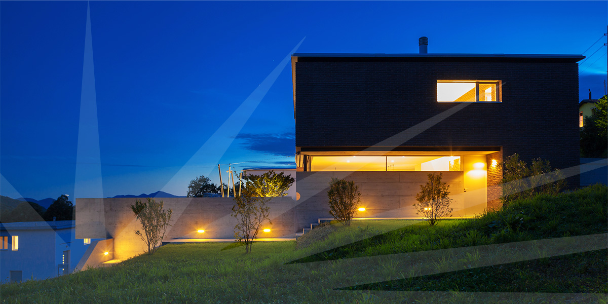 picture of a house with modern landscape lighting